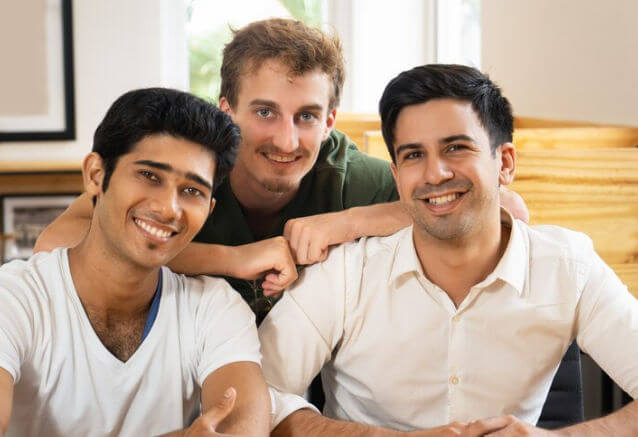 Gay couple inviting a third